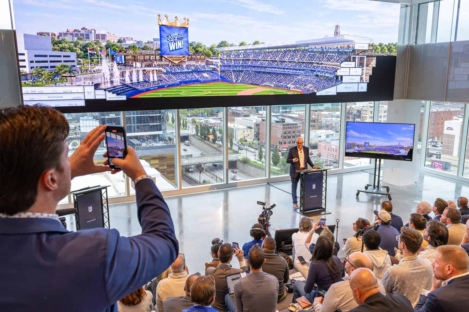 Earl Santee, senior principal and founder at Populous, reveals design features for the Royals' new ballpark at Crown Center, including stadium grounds built into the natural limestone of the area; photo by Haines Eason