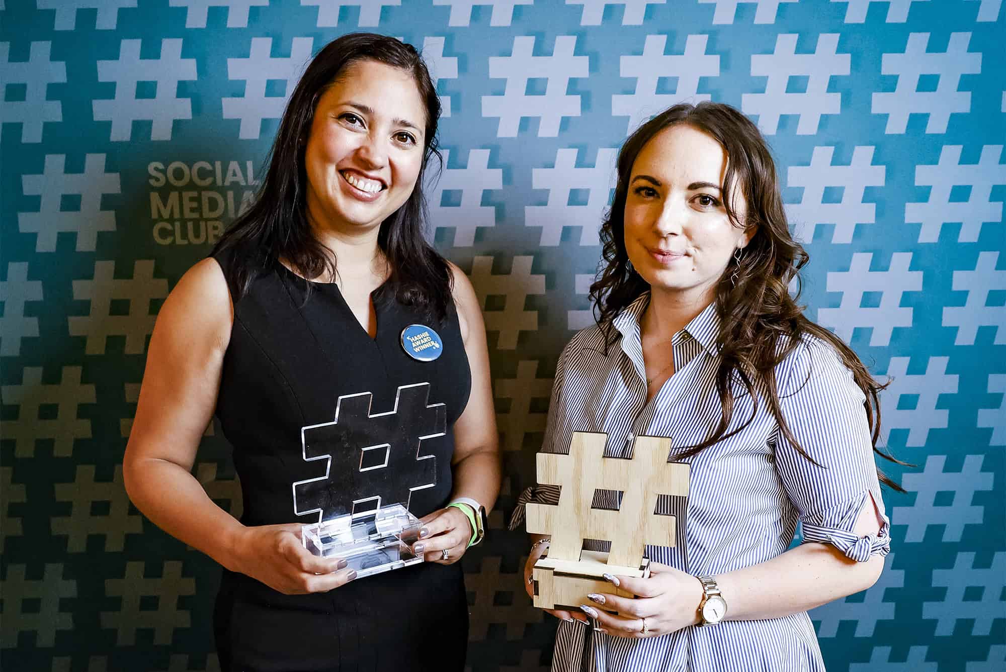 2025 Hashie Award winner Krystal Ruiz, a public relations specialist and social media manager at the Los Angeles Public Library, holds her trophy alongside Mandy Hoskinson, vice president of operations for Social Media Club, organizer of the Hashie Awards, which were held in Los Angeles in 2026; courtesy photo