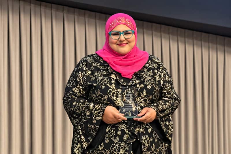 Maliha Khan, CEO and founder of Khanect the Dots, holds the Kansas City AI Club’s Women’s AI Champion Award; photo courtesy of Chris Kovac, Kansas City AI Club