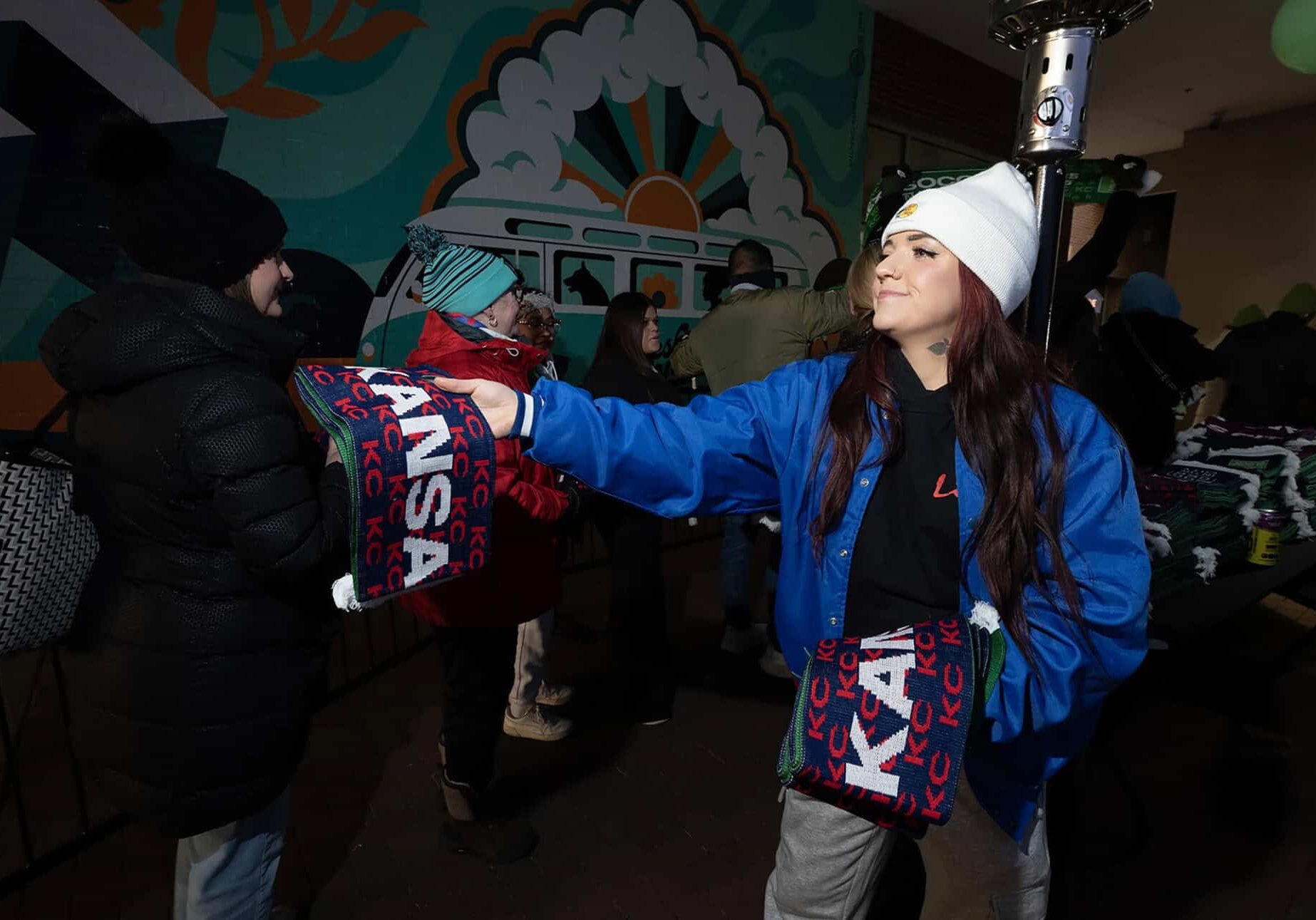 The first thousand fans received a World Cup scarf as they arrived this winter at a region-wide watch party for the FIFA Final Draw in December at KC Live! in the Power & Light District; photo by Julie Denesha, KCUR