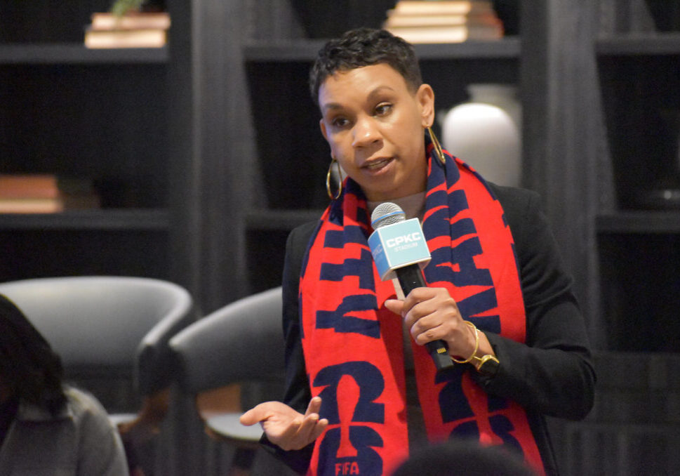 Nia (Richardson) Webster, assistant director of Neighborhood Services Department, addresses a crowd gathered at CPKC Stadium for a roundtable discussion about preparing small businesses for the 2026 World Cup in Kansas City; photo by Taylor Wilmore, Startland News